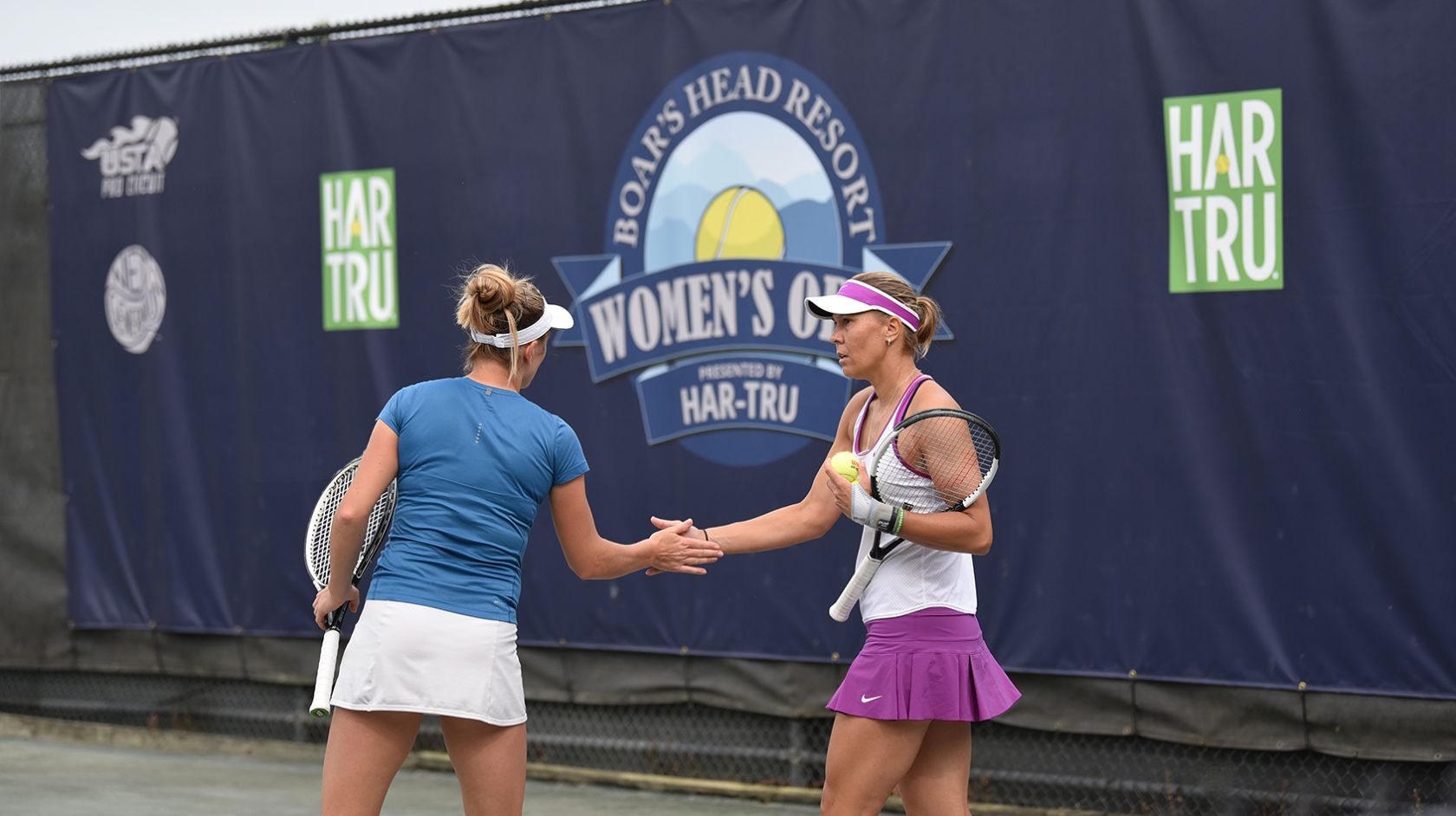 Two women tennis players after match