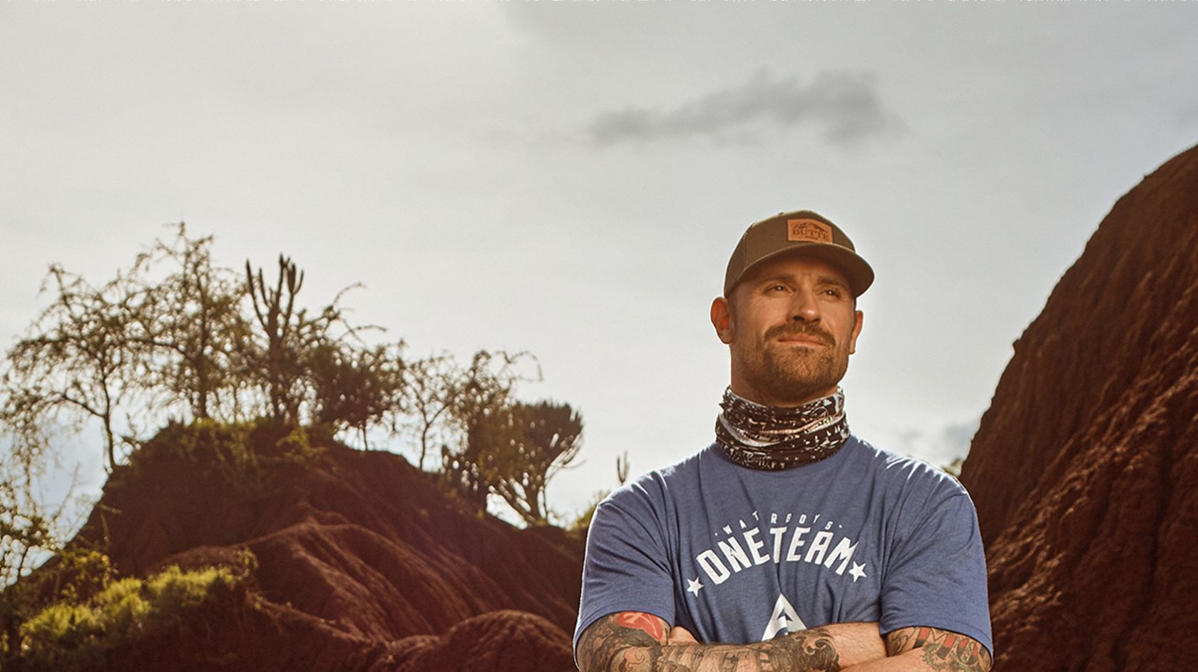 Chris Long Standing In Front Of A Mountain