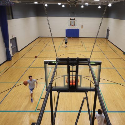 People Playing Basketball In A Gym