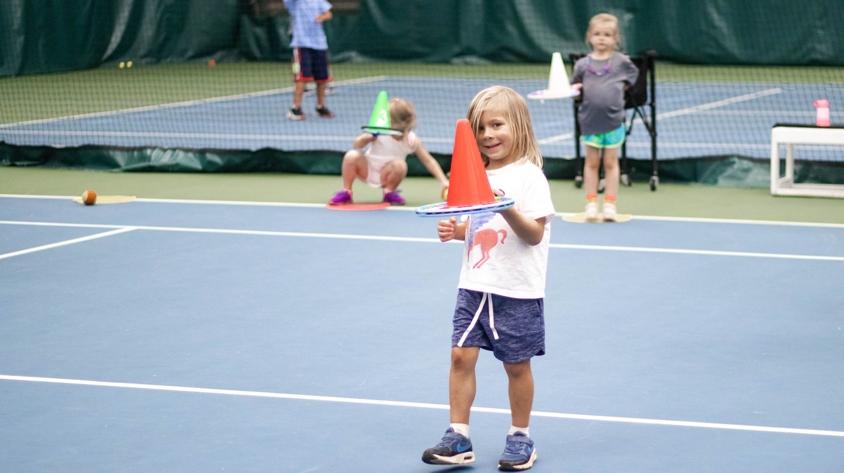A Girl Holding A Tennis Racket