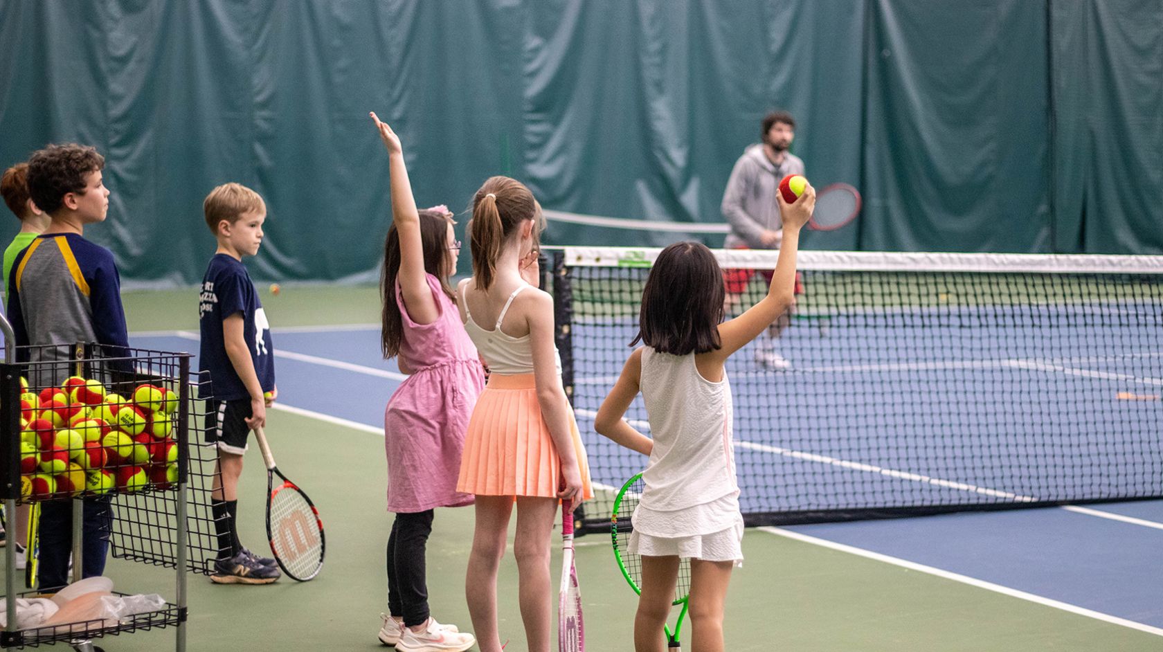 Kids Playing Tennis On Court