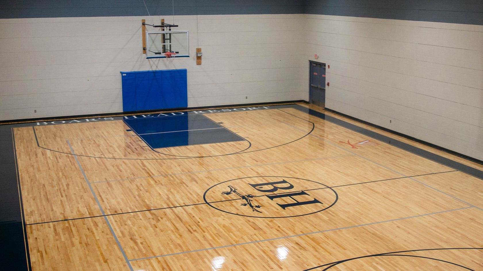 A Basketball Court With A Basketball Hoop